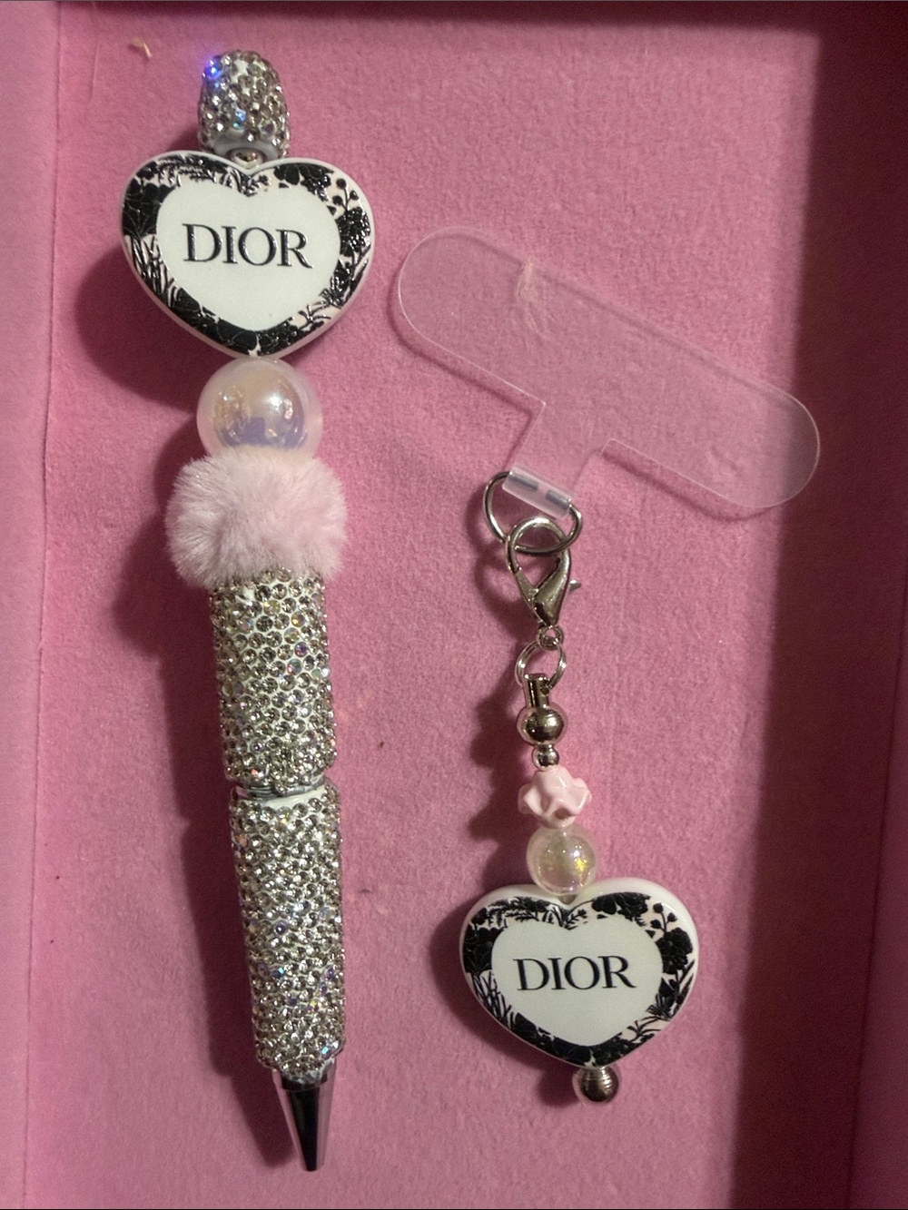 Silver rhinestone pen and matching phone charm w/attachment.